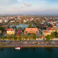 drone-view-of-buildings-and-praek-tuek-chhu-river-in-kampot-cambodia